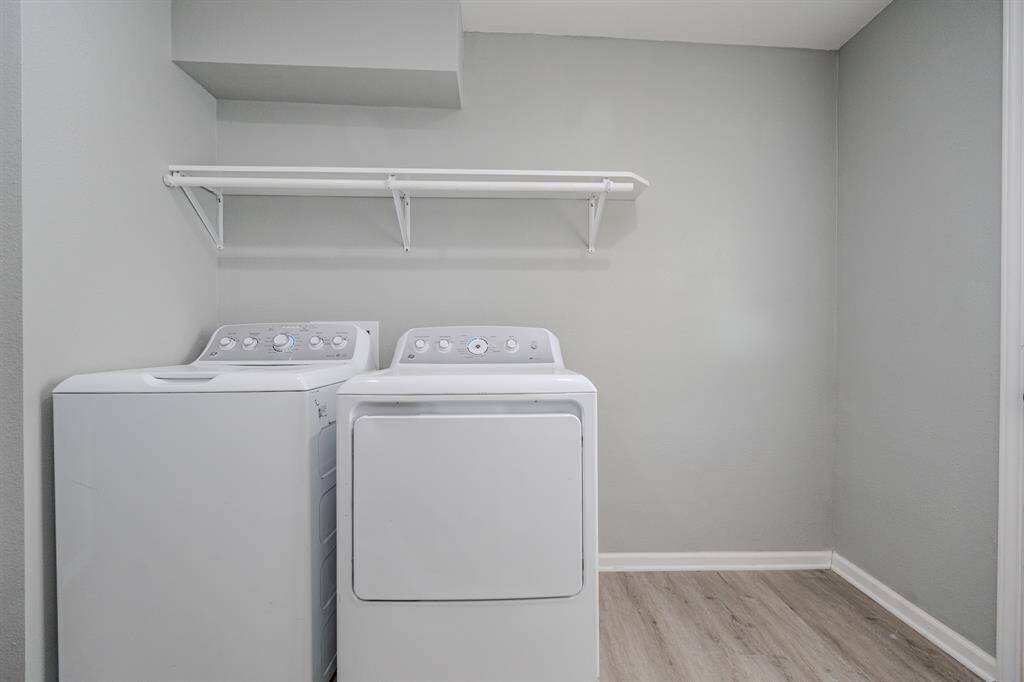 Convenient upper shelving for storing laundry essentials