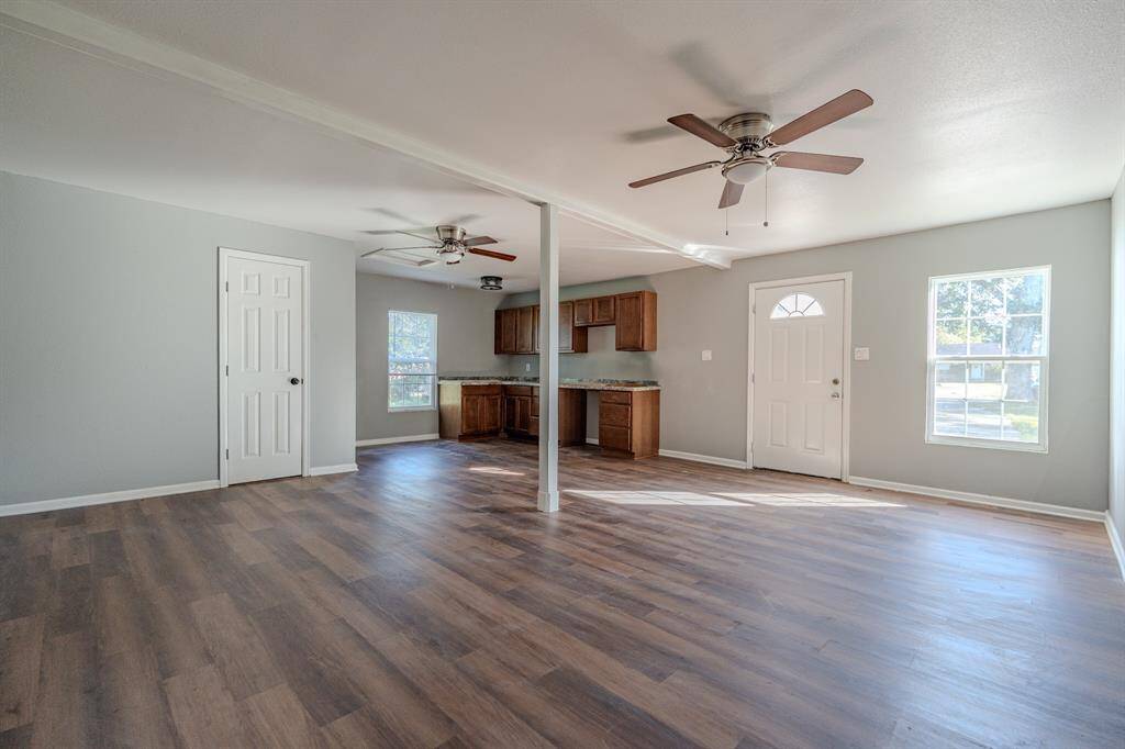A spacious garage apartment with an open floor plan and ample natural light. Accessible plumbing and electrical connections.