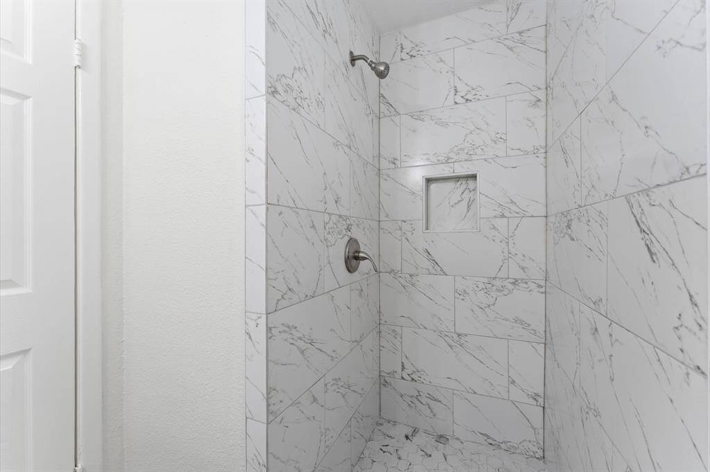 he backyard of this home is a real gem, offering ample space to suit a variety of needs.
