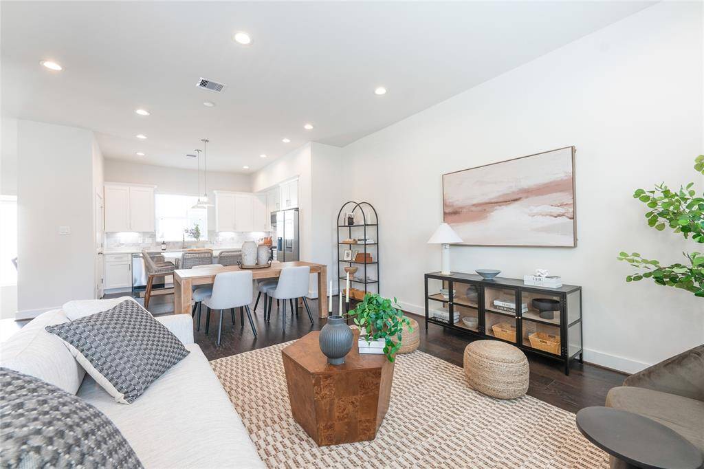 Elegant open-concept dining and living area with modern finishes and abundant natural light.