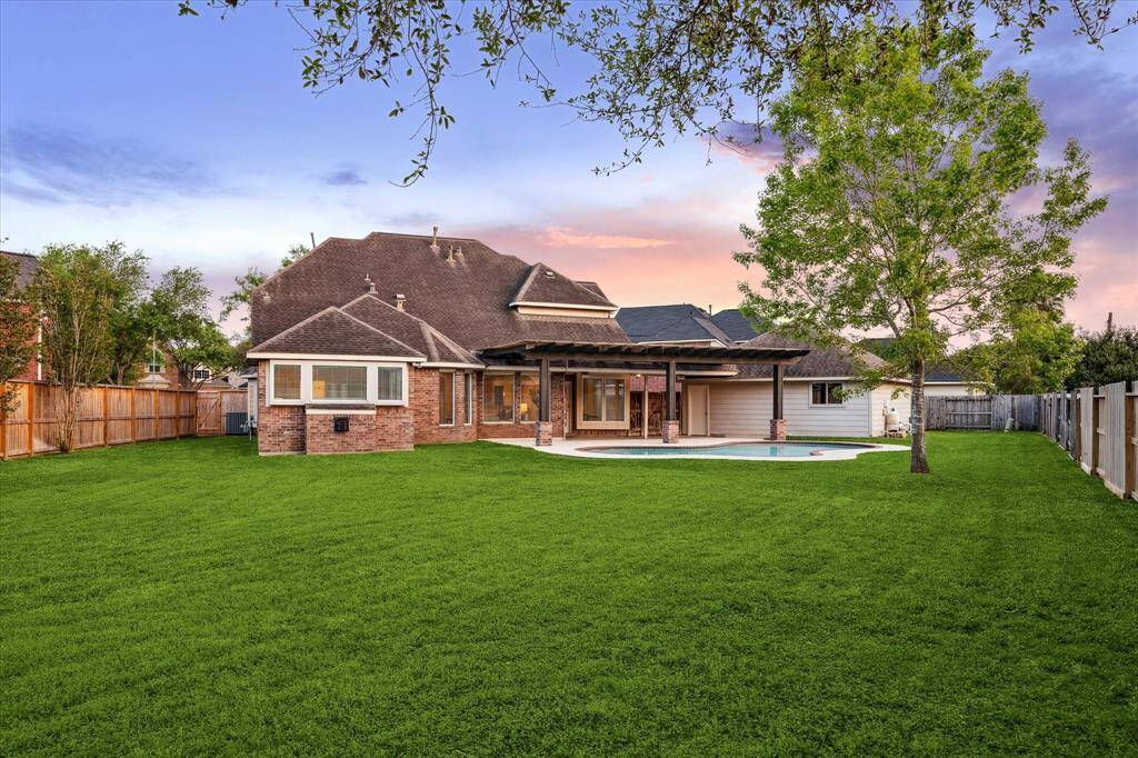 The expansive backyard offers plenty of space for future landscaping or outdoor activities.