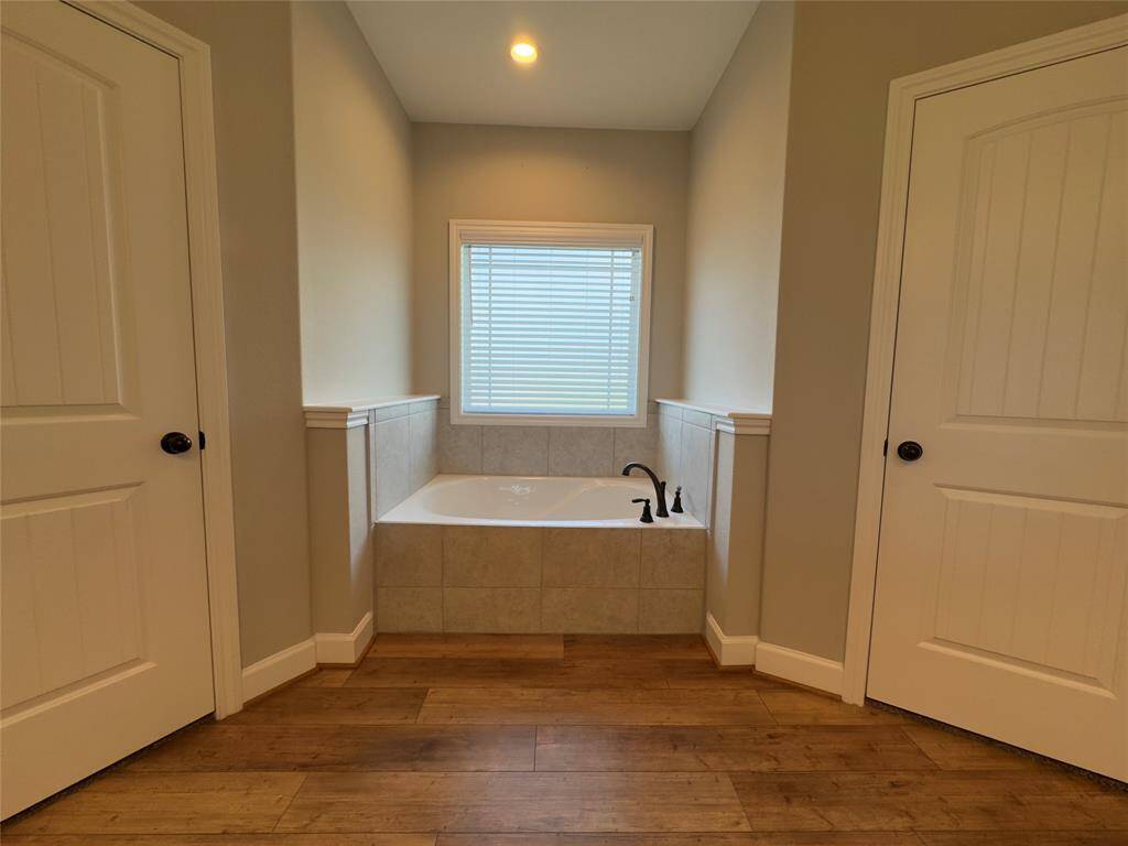 Luxurious master bath with elegant finishes and a relaxing tub,  separate shower perfect for unwinding.