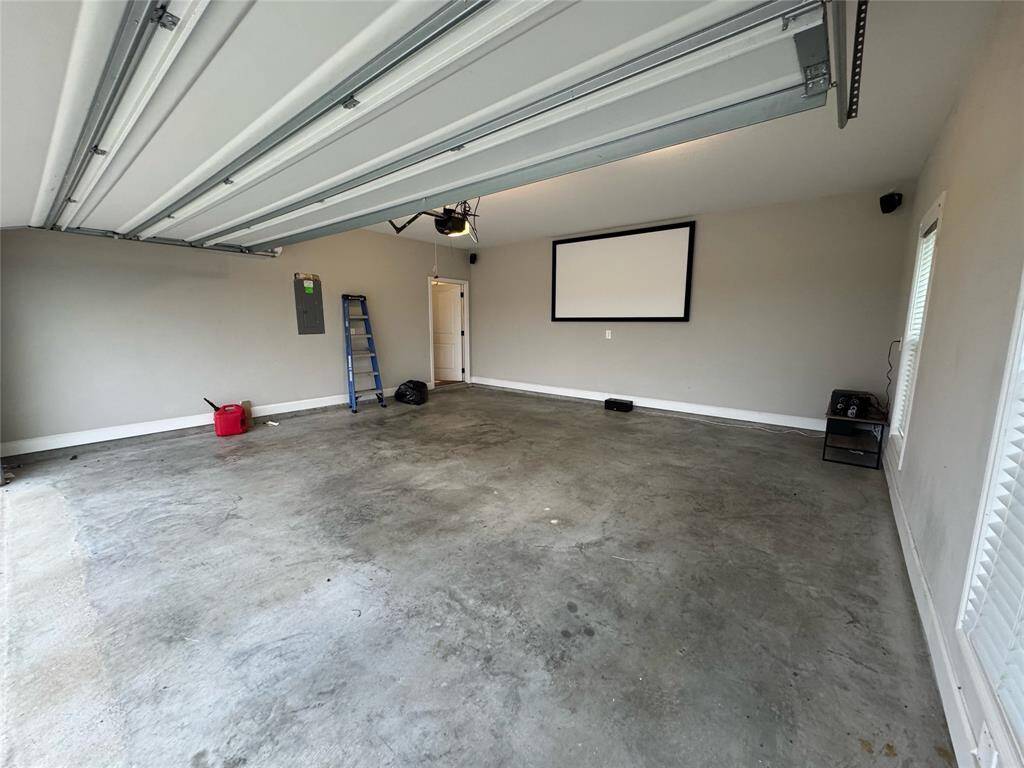 Enjoy a fun family night in your air conditioned  garage watching movies.