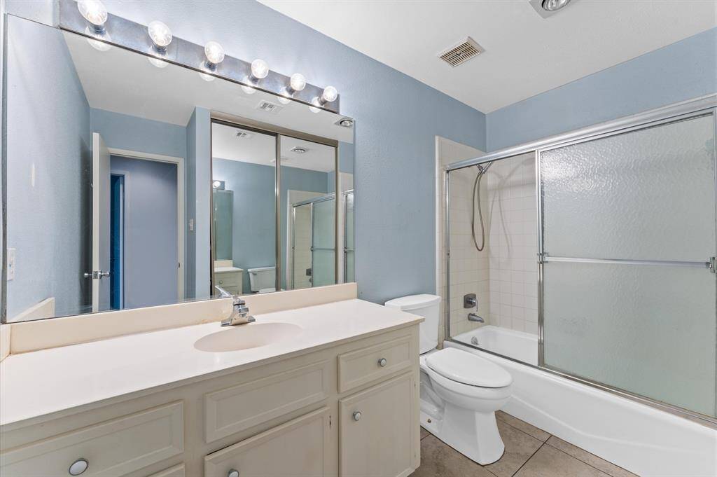 Large Spacious Bathroom with separate vanities, Granite Countertop, Lots of mirrors with lights