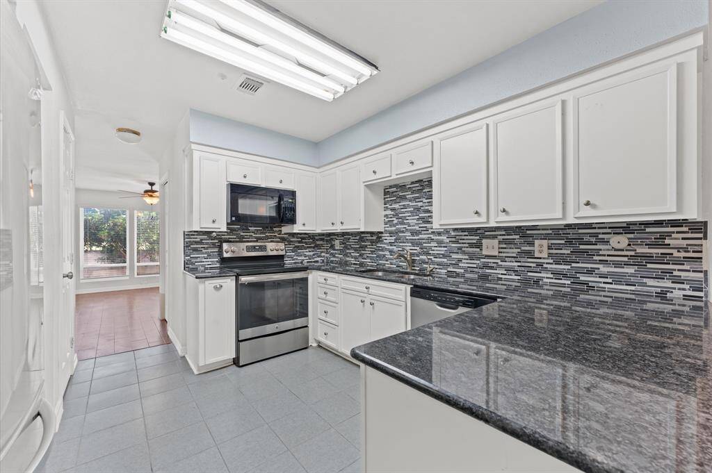 Nice granite counter top with back spalash tile to match