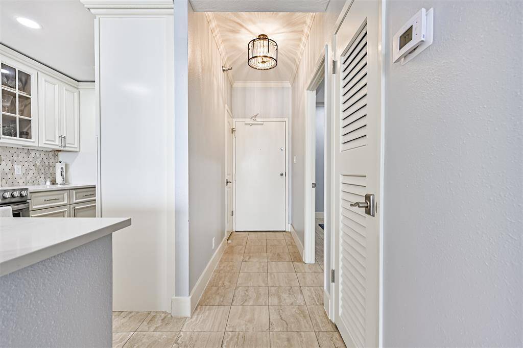 Looking Back Towards the Front Door Showing the Travertine Marble Floors Throughout the Unit and the Nice Lighting Selections in This Condo! Why Settle for Over-Priced Units with Dated Interiors on Lower Floors, When You Deserve the Best?!!!