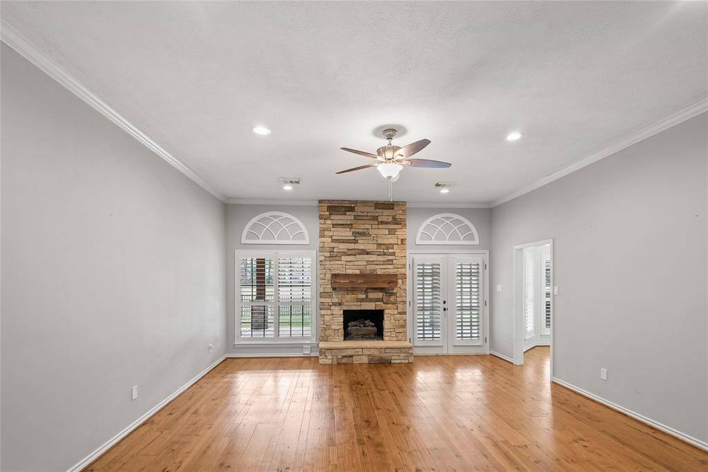 Straight ahead as you enter is the large living room. Note the updated wood floors!