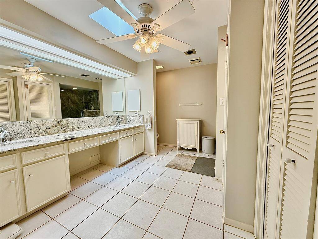 Large primary bathroom with tons of storage.