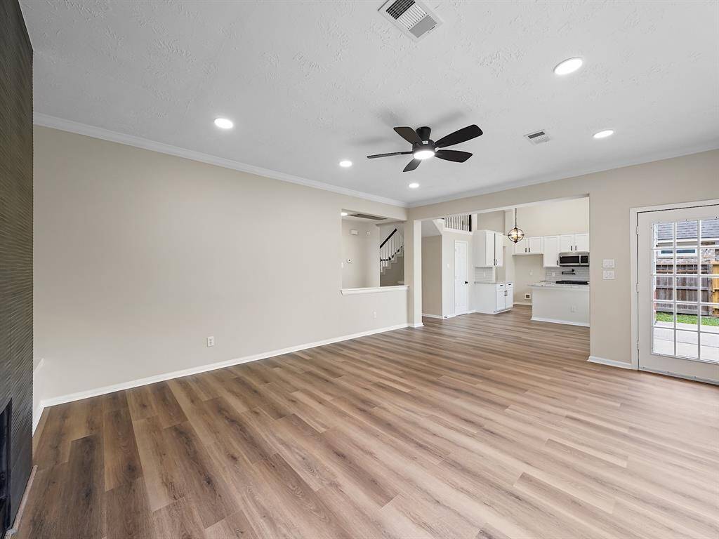Formal Living room showcasing the new vinyl flooring and new lighting.