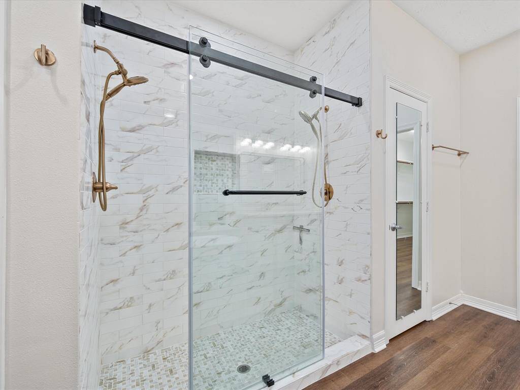 Double shower heads in this gorgeous shower!