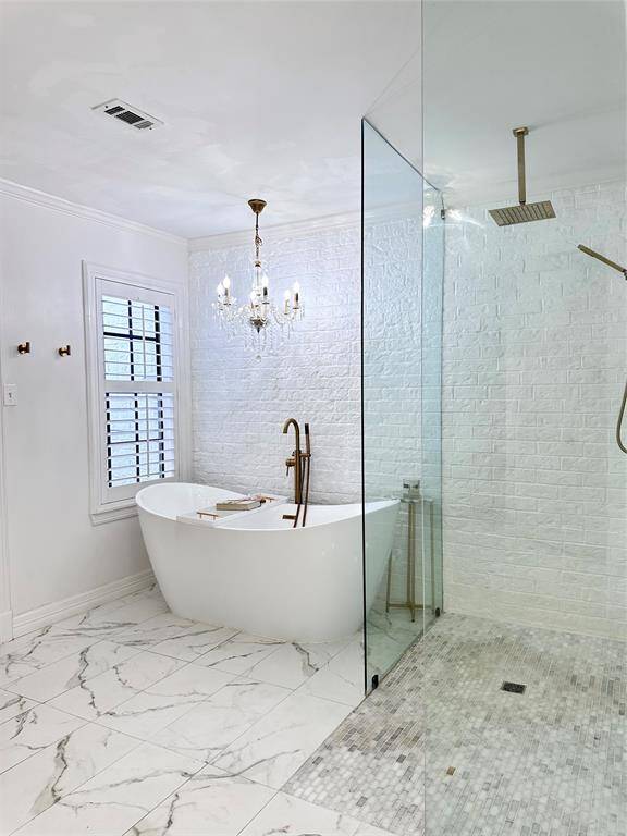 Primary bathroom and grand closet have a dedicated entrance that allows you to enjoy the spa like features without waking those who get to sleep in.