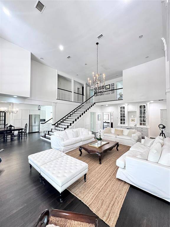 Living room with custom staircase to the 2nd story.