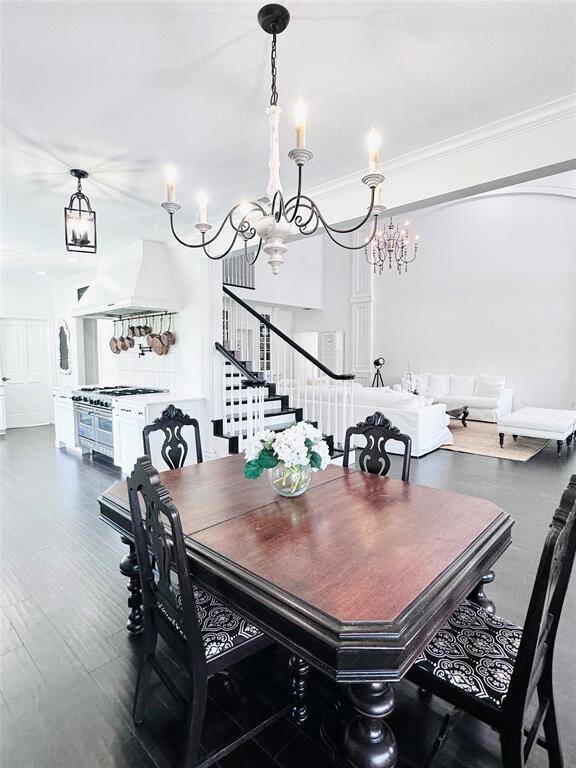The well situated breakfast room has a view of the gorgeous pool and the main living spaces.