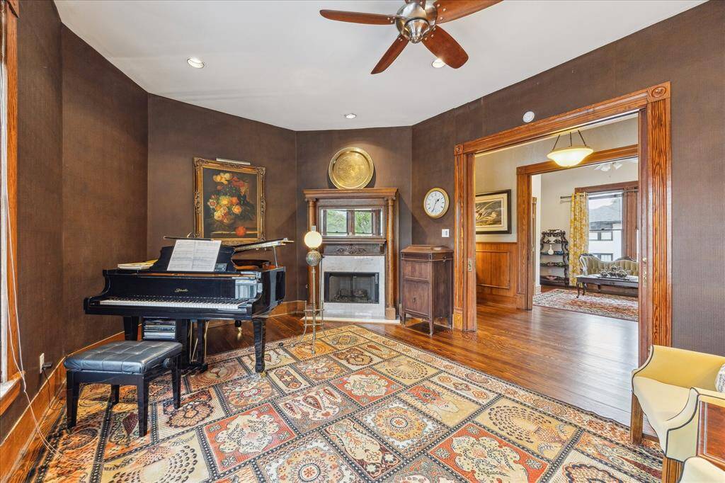 This room has original pocket doors and a heart warming fire place