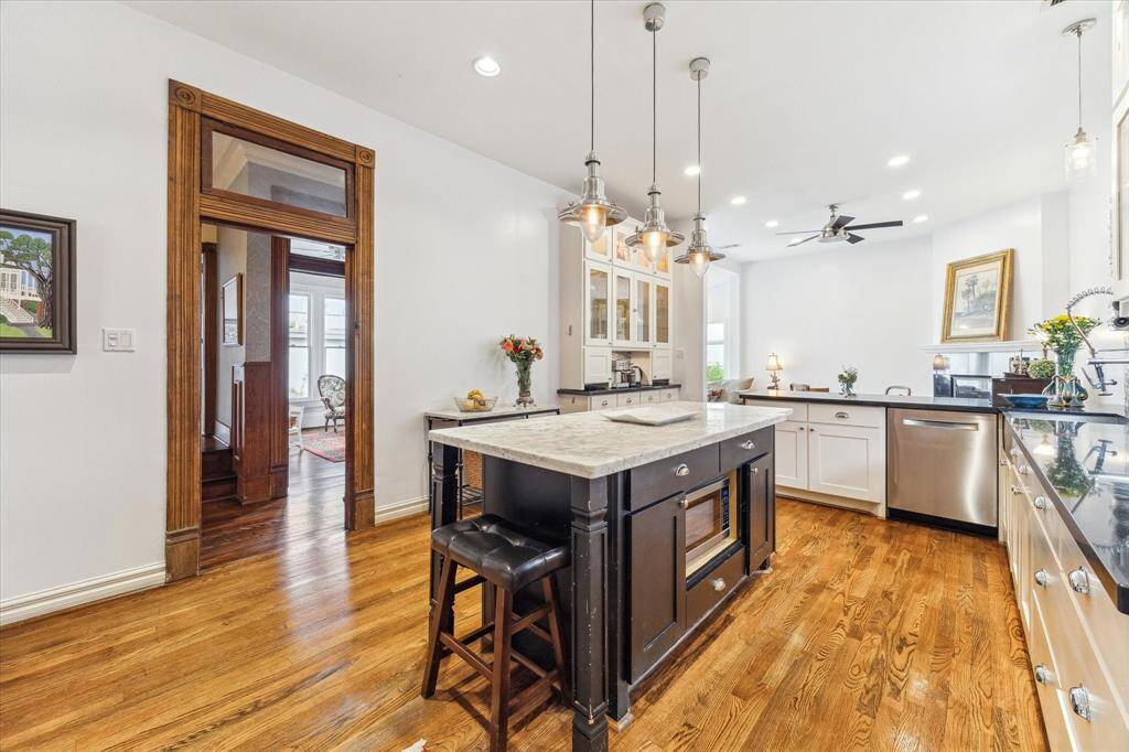 Enjoy this wonderful kitchen which is open to the family room. Granite countertops, pendent and recess lighting
