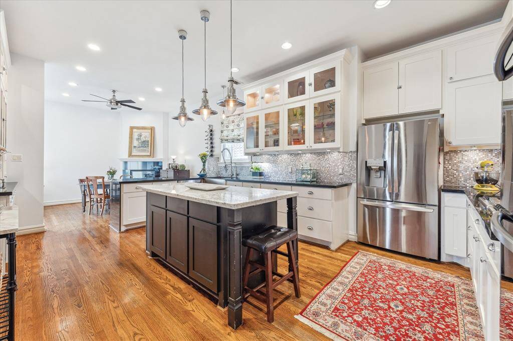 Stainless Steel Appliances, and glass front cabinets