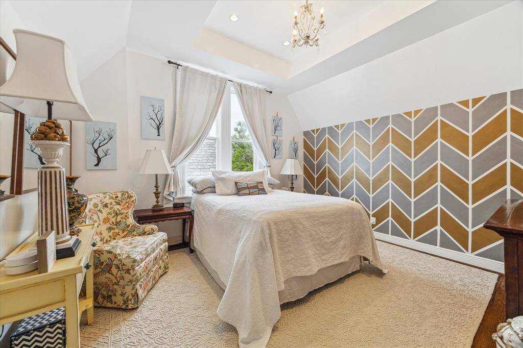 Primary Bedroom has tray ceilings and is light and bright.