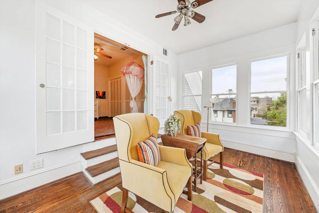 Step down into the sunroom with a view of Heights Blvd. Enjoy a good book and watch the activity on Heights Blvd. It is like sitting in a tree house.