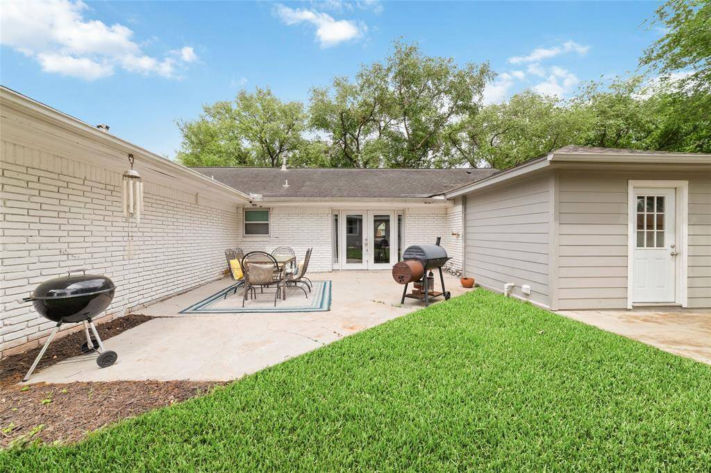 A view from the backyard shows off the home's inviting outdoor living area, great for entertaining or family gatherings.