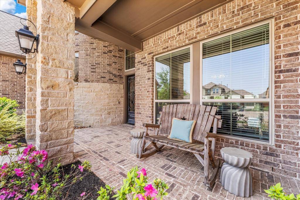 Greet family and friends from your covered front porch