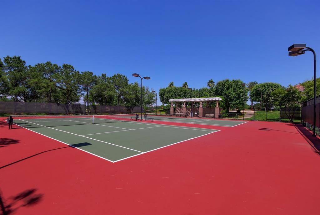 One of two lighted neighborhood tennis courts. This one is by the clubhouse overlooking a lake. There is a second court in the community offering pickleball as well as tennis.