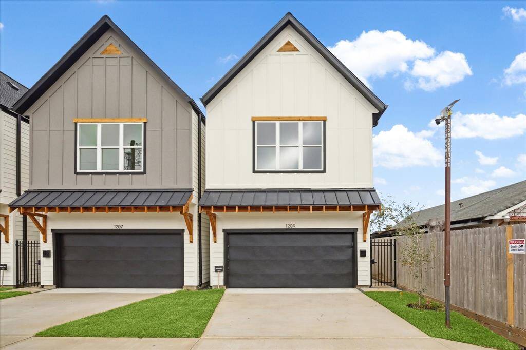 With a perfect balance of traditional and contemporary design, this 2-story farmhouse blends durable hardie sidding with lightly-stained treated wood.