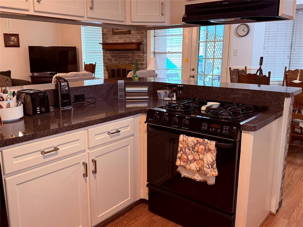 Kitchen looking into living room