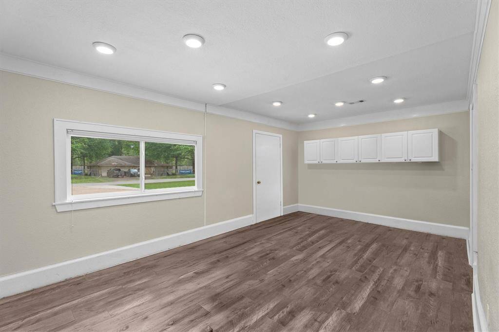 The versatile converted garage space, could be a perfect home office or 4th Bedroom