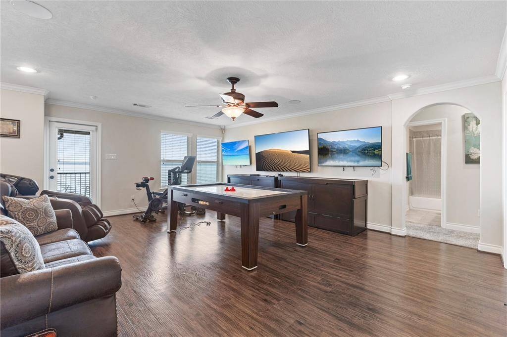 This spacious game room offers endless entertainment options, providing ample space for games, exercise and gatherings.