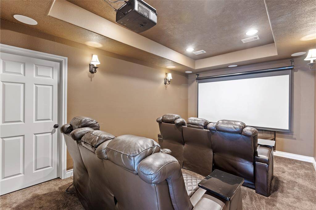 The media room features a high-quality projector, creating the perfect space for movie nights or relaxing entertainment. Versatile and spacious, it can easily be transformed into a 5th bedroom to suit your needs.