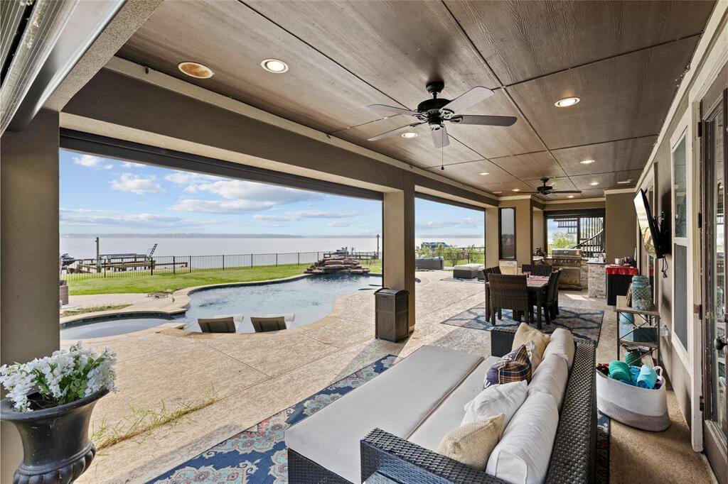 The covered patio offers a spacious, shaded retreat with a perfect view of the entire backyard. Ideal for relaxing or entertaining, it’s a comfortable space to enjoy the outdoors.