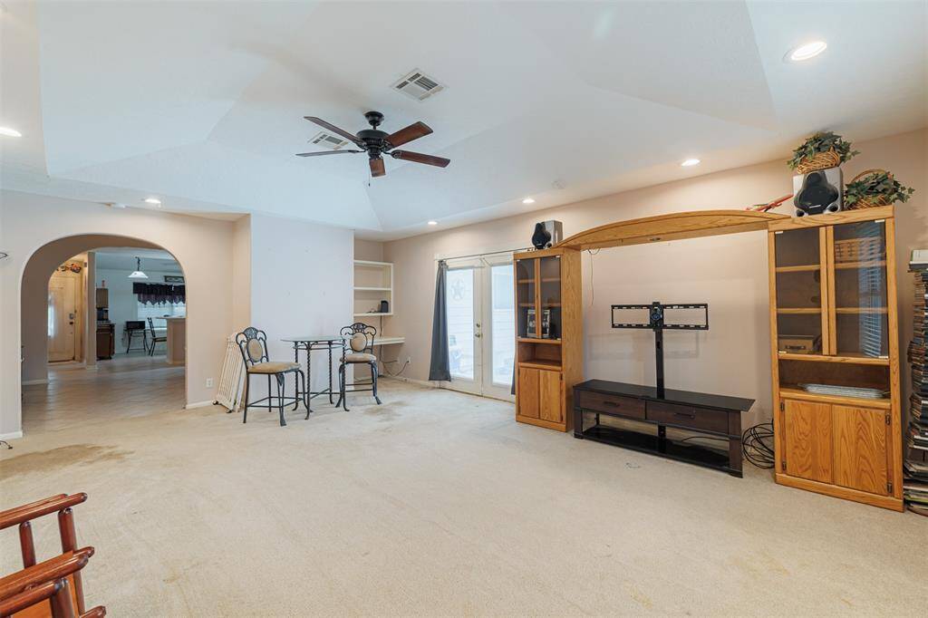 Another view of the game room showing the built-in desk area. There are also double doors in the game room that lead out to the backyard.