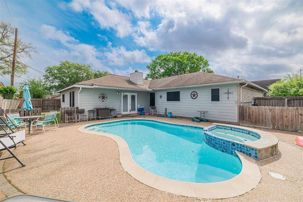 Another view of the swimming pool looking towards the back of the home.