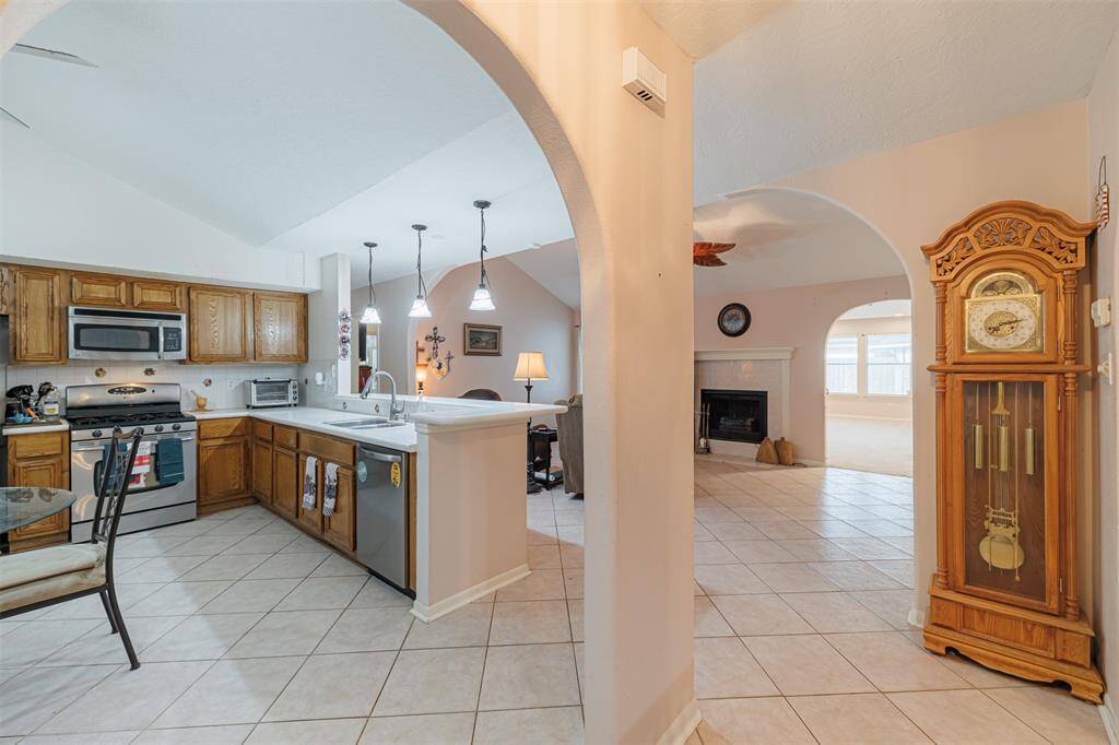 The entry also leads to the kitchen and family room.