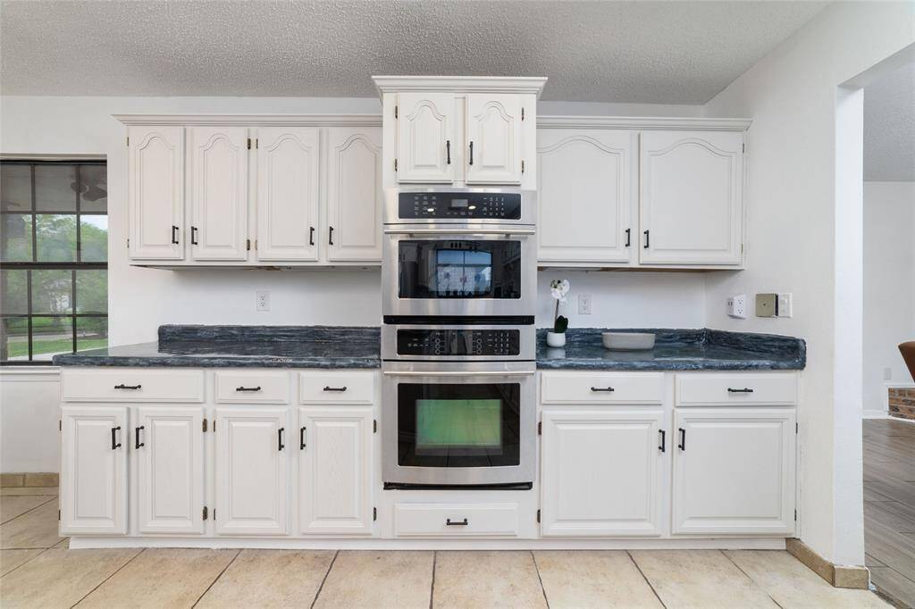 Spacious kitchen with dining area.