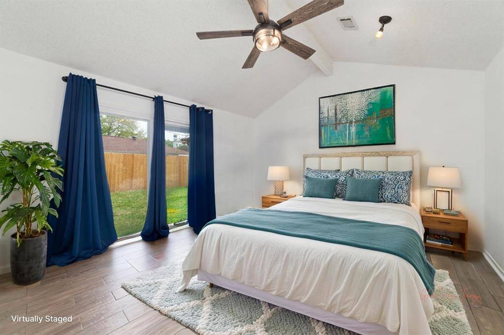 Primary bedroom with enclose bathroom and walk-in closet.