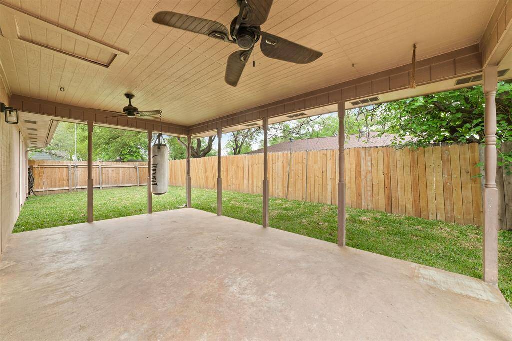 Spacious covered patio for table, bbq and relax area.