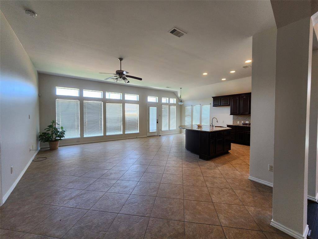 View of the family room, breakfast area and gormet island kitchen taken from the Entry Gallery