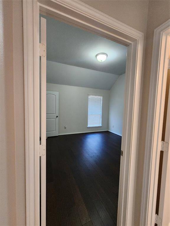 Step into Bedroom 2, where soaring high ceilings create an airy, spacious feel. The elegant wooden floors add warmth and charm, while the generous walk-in closet offers ample storage for a clutter-free retreat.