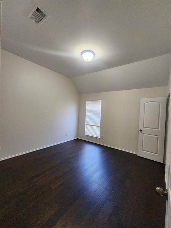 Step into Bedroom 3, where soaring high ceilings create an airy, spacious feel. The elegant wooden floors add warmth and charm, while the generous walk-in closet offers ample storage for a clutter-free retreat.