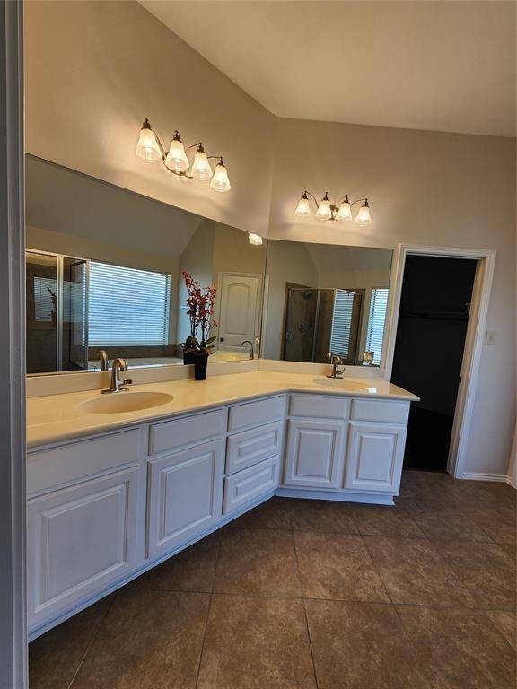 Upgrade your daily routine in the luxurious primary bath, featuring dual sinks and an expansive vanity area. Enjoy ample storage with abundant cabinetry, ensuring a clutter-free and organized space. Designed for both style and functionality, this bath provides the perfect blend of comfort and convenience.Upgrade your daily routine in the luxurious primary bath, featuring dual sinks and an expansive vanity area. Enjoy ample storage with abundant cabinetry, ensuring a clutter-free and organized
