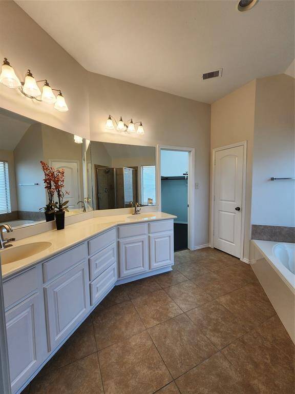 Primary Bath;another angle showing the Primary closet entrance at the end of the vanity