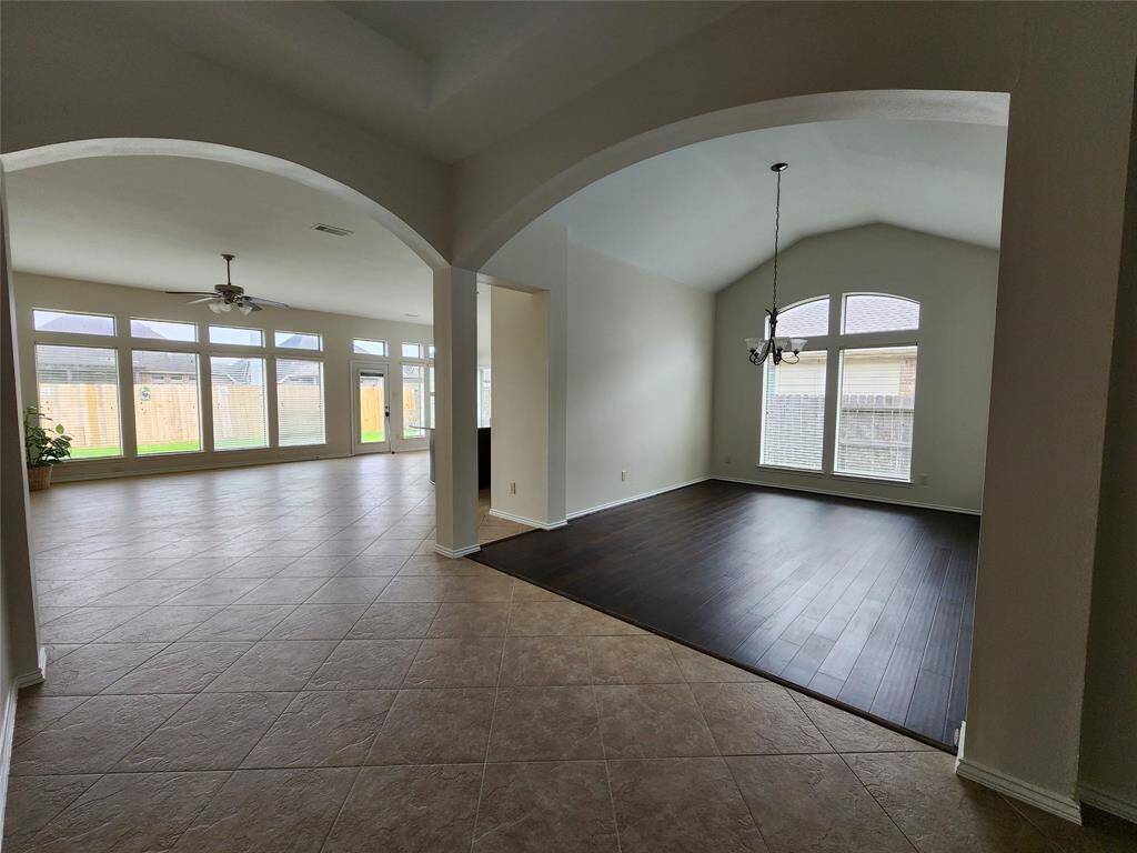 Experience an elegant welcome with a grand entryway featuring stunning gallery arches that gracefully lead into the spacious family room, gourmet kitchen, and sophisticated formal dining area—creating a seamless flow perfect for both everyday living and entertaining.