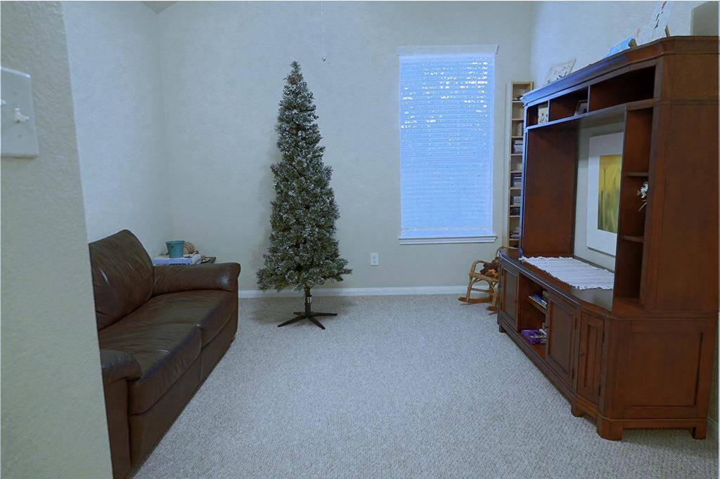 Den upstairs adjacent to 3rd bedroom