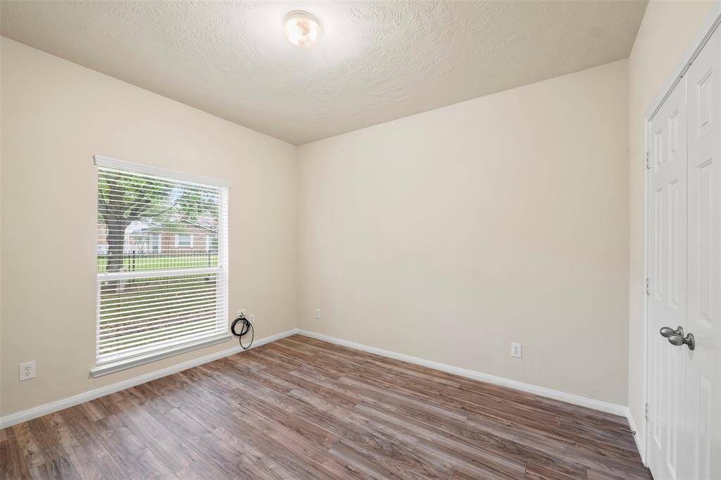 Another secondary bedroom with double door closet.