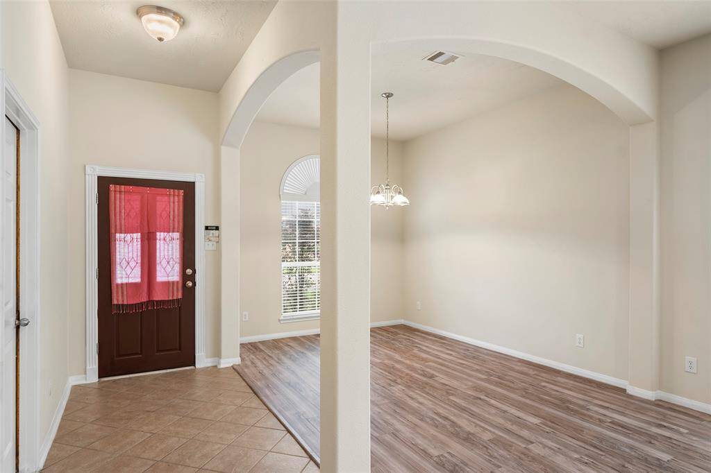 View of front entry way and formal dining/ front office area