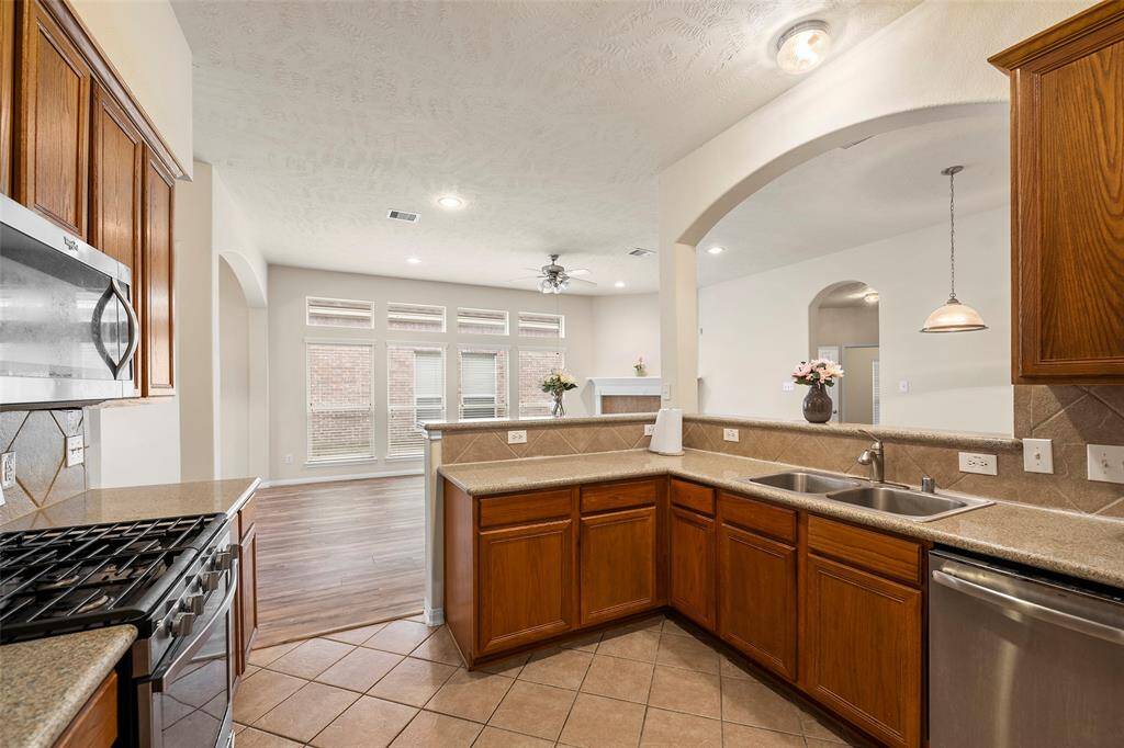 View of kitchen looking out into the family room.