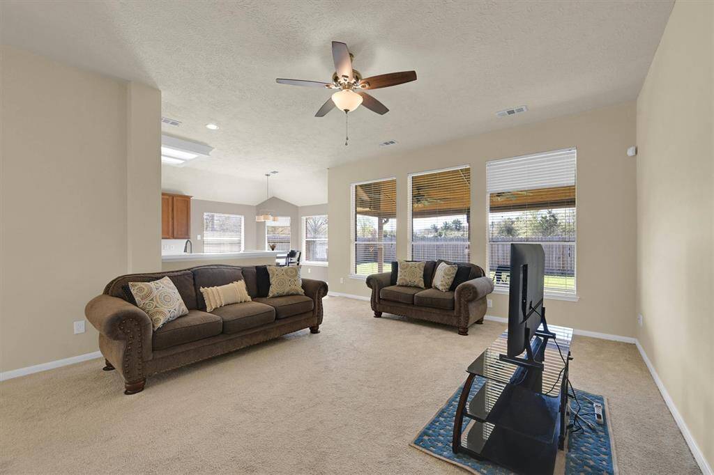 Large and open floor plan as kitchen opens to the family room.  Lots of windows and natural light with private spacious back yard views.