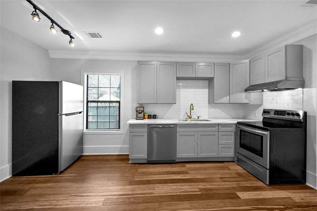 Hyper Modern kitchen with quartz countertop.