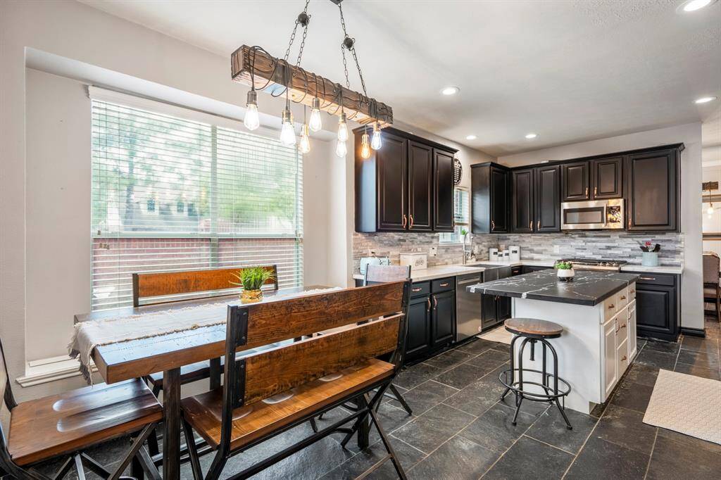 Enjoy casual meals or sip your morning coffee in the cozy eat-in dining area just off the kitchen—a perfect spot to start or end your day.